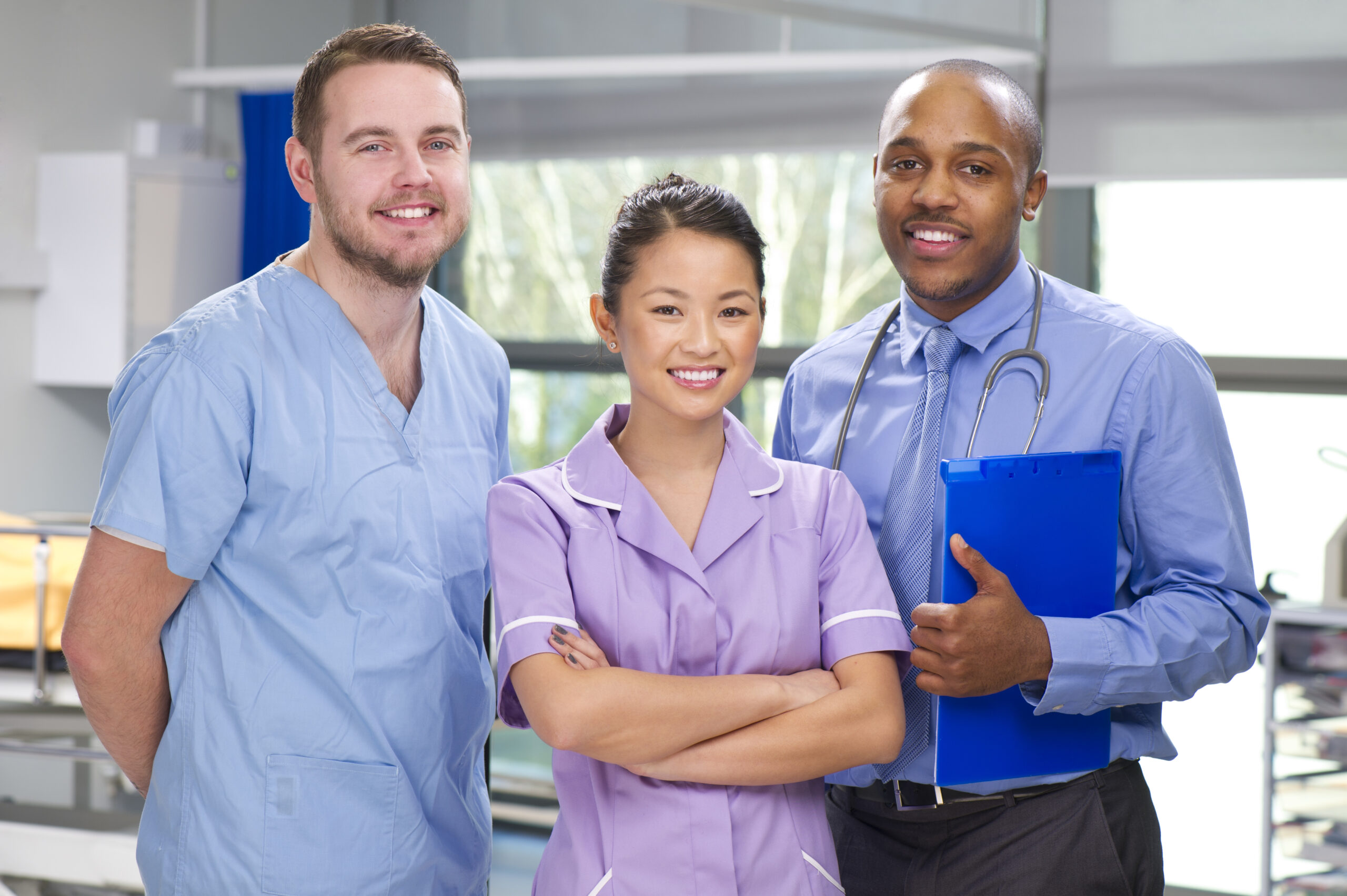 three medical professionals on a modern hospital ward